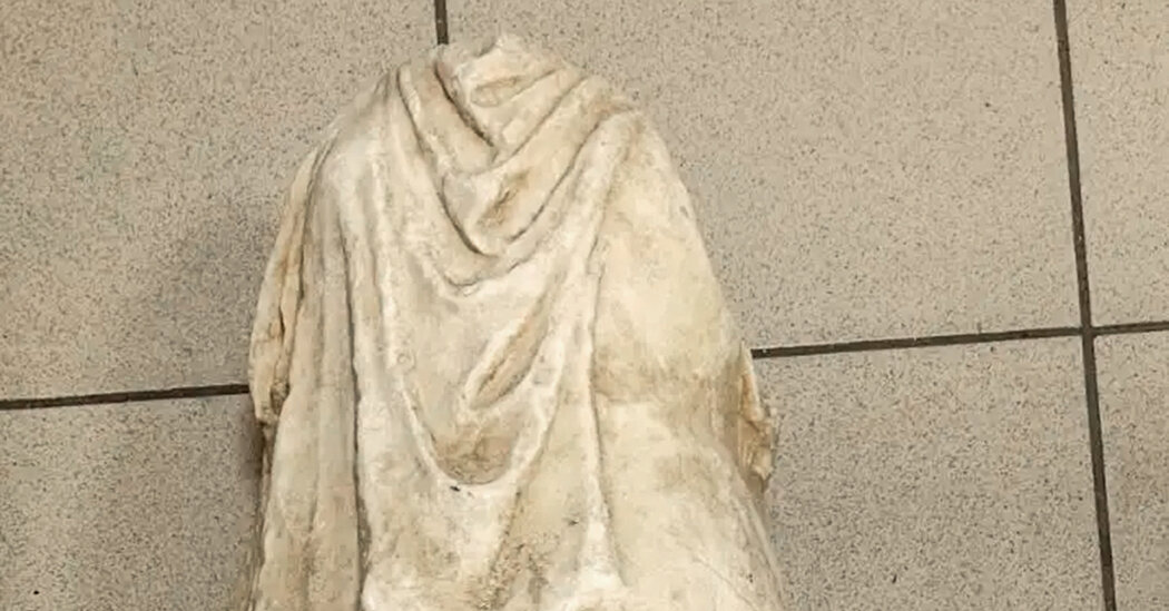 Ancient headless statue found among garbage in Greece