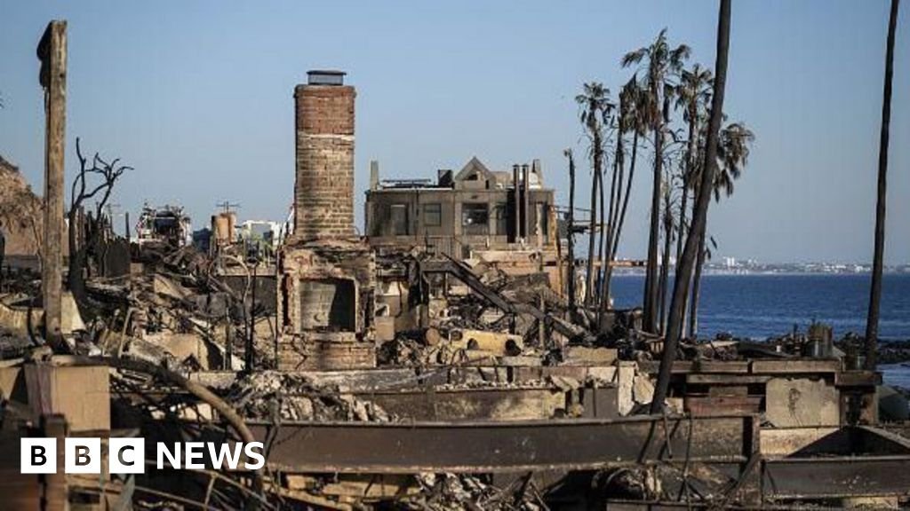 Los Angeles’ strong winds ease, giving tired firefighters some respite