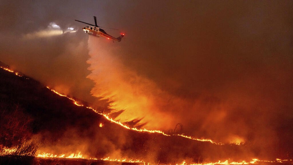 Massive wildfires engulf the worst-hit areas of Los Angeles as the death toll climbs to 10