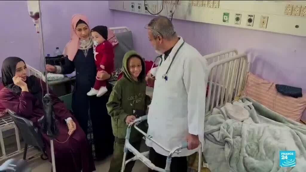 A Palestinian pediatrician continues to work in a hospital in Gaza despite losing his leg