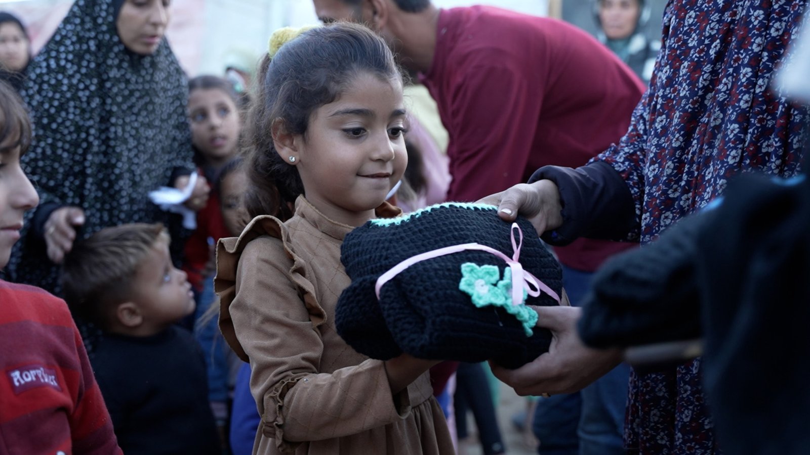 Making warm clothing for displaced children in Gaza