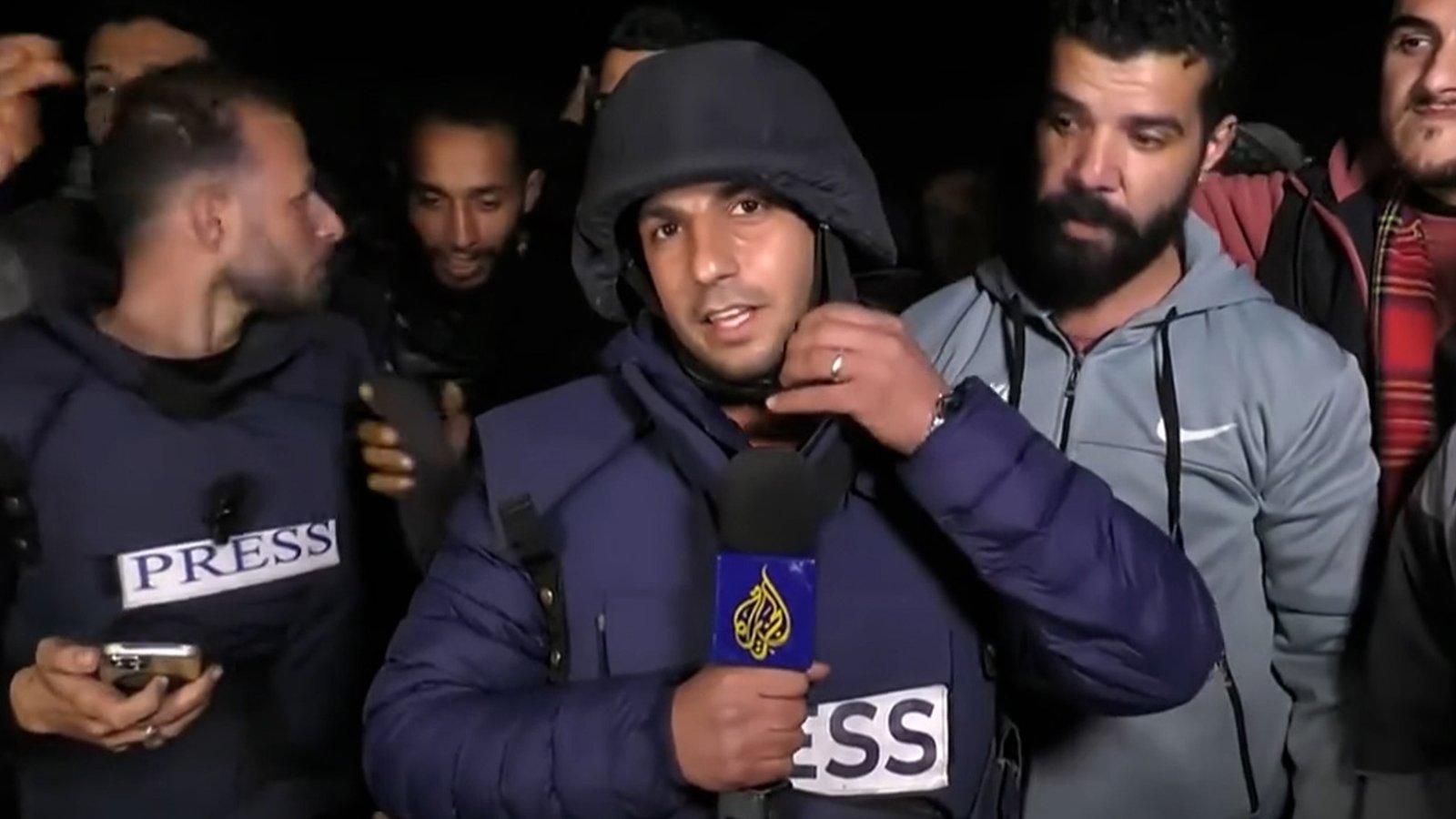 Gaza Al Jazeera reporter takes off protective gear